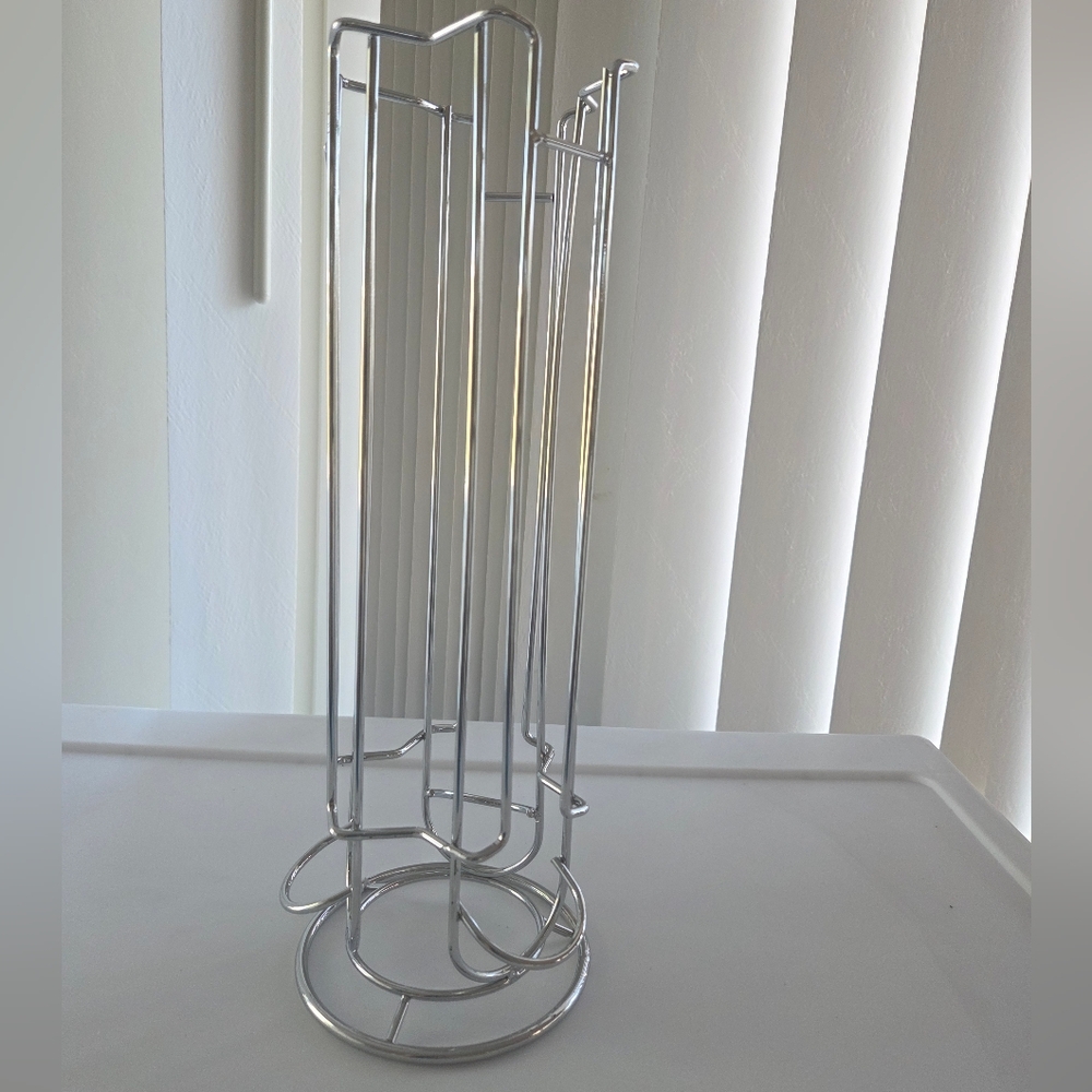 New Spinning Chrome Coffee Pod Holder In Original Shipping Box.